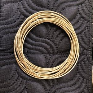 Gold tone multiple wire bangles